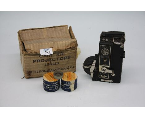 A CHC Midas 9.5mm Film Camera Projector No.7442 in original box and with rolls of film “To be developed before Feb 1959”.