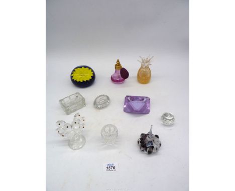 A Caithness ring stand (C34874) and a glass paperweight having yellow flower, damaged pineapple paperweight, etc.