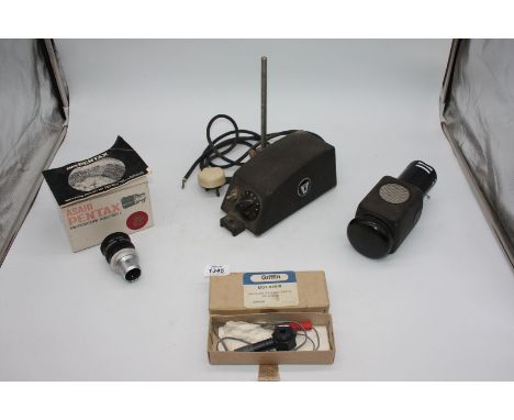 A boxed Asahi Pentax Microscope Adapter II for 35 mm SLR Camera with instruction booklet, a boxed Microscope Illuminator 12V 