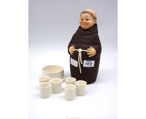 A 1950's Goebel Monk decanter set complete with six glasses, some chips and crazing, 10 1/2'' tall.