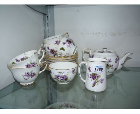 A Hammersley 'Victorian Violets' part tea set consisting of teapot, five cups and six saucers,milk jug, sugar bowl, etc.