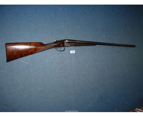A 12 bore box-lock double barrelled, double trigger side by side shotgun by W.W Greener having 28'' sleeved barrels, chequere