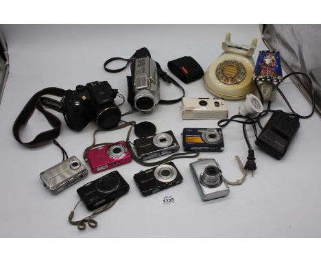 A box of Digital Cameras etc including a Fujifilm FinePix S7000, a Fujifilm FinePix J30, a Fujifilm FinePix JX, a Kodak EasyS