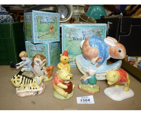 A Royal Doulton Winnie the Pooh collection to include; 'Pooh and the party hat', 'Tigger Signs the Rissolution', 'Christopher