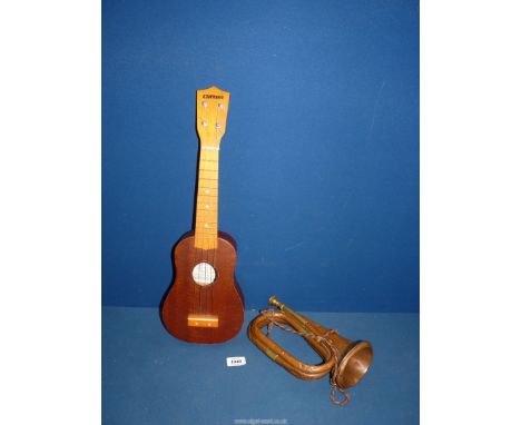 A 19th century well used brass and copper bugle stamped England and a Clifton Sopran Ukulele.