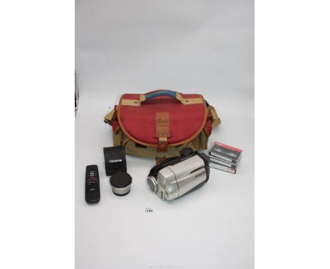 A Hitac 8mm Video Camera/Record VM-E558LE, Titanium Lens, remote controller and A.C. adapter, all in a soft case.