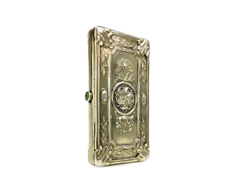 EARLY 20TH CENTURY FRENCH SILVER GILT CIGARETTE CASE, the exterior cast with foliate motifs, peridot set button, 8cm wide, 74