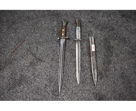 A German Ersatz bayonet having metal grip and metal scabbard, Soligen mark to blade, scabbard marked 42 ASW, blade length 24c