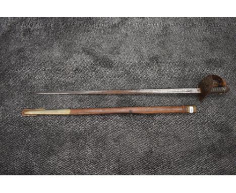 A 19th century British Officers Sword Pattern 1897, blade marked Smith's of London, decorated blade, leather and metal scabba