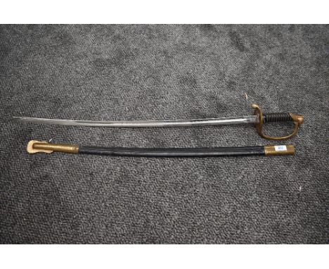 A Vanguard United States Marine Corp NCO Sword having decorated blade, with scabbard, scabbard numbered 32, blade length 80cm