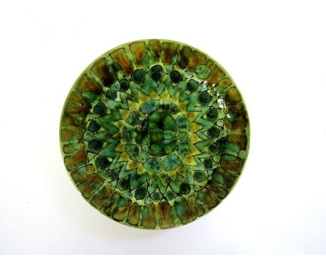 A Poole Delphis dish, painted design in green and ochre. Blue TV mark to base. 20.5cm diameter. (Graze to rim edge)
