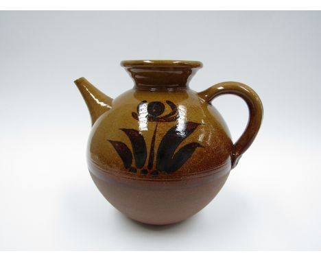 PETER DICK (1936-2012) A Coxwold Pottery teapot of large proportions. Treacle glaze with painted floral detail. Unmarked. 24c