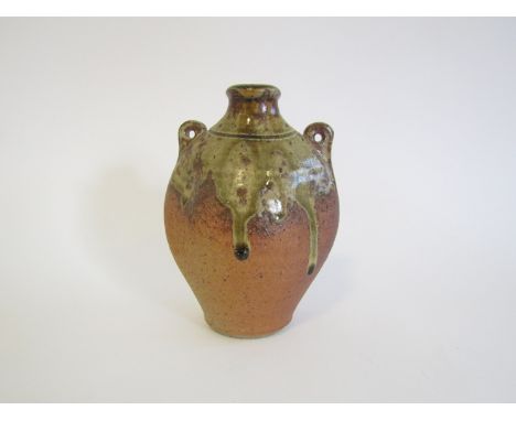 A Muchelney Pottery Pilgrim bottle by John Leach, biscuit and olive green glaze. Impressed seal and dated 1998. 14.5cm high