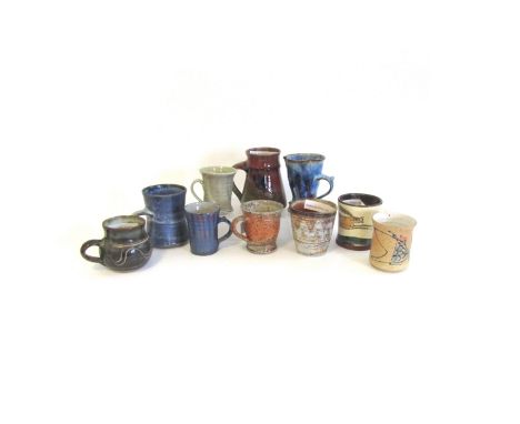 A collection of ten studio pottery mugs and Yunomi to include Winchcombe, Chris Lewis, Philippa Lee, Steve Woodhead, Jim Robi