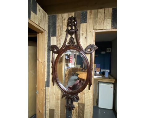 An ornate carved wood wall mirror with big bevel - 143cm high x 75 wide