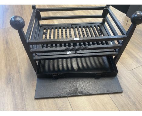 A cast iron fire basket
34cm H x 47 W x 32 D