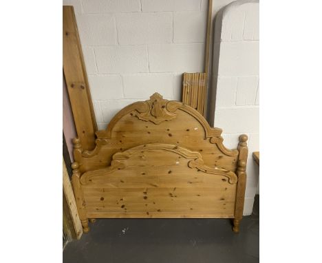 A pine double bed