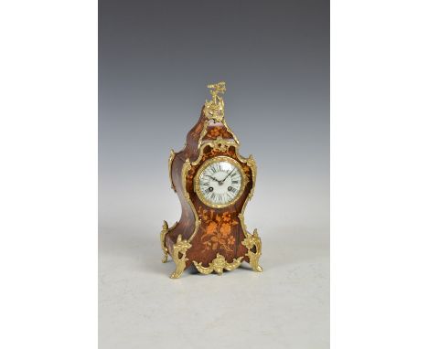 A late 19th century rosewood, marquetry inlaid and gilt metal mounted mantle clock, the circular porcelain dial with Arabic a