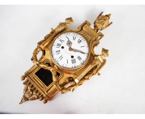 A 19th century French ormolu cartel clock, the circular convex enamel dial with Arabic and Roman numerals within an Neo-Class