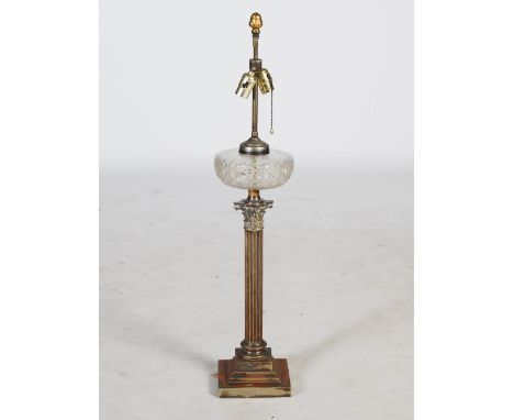 A late 19th/ early 20th century electroplated Corinthian column paraffin burning lamp converted to a two light table lamp, wi