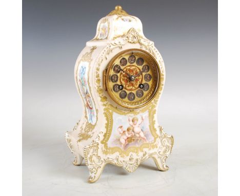 A late 19th century French Longwy porcelain mantle clock, with circular Arabic numeral dial above a putti decorated panel, im