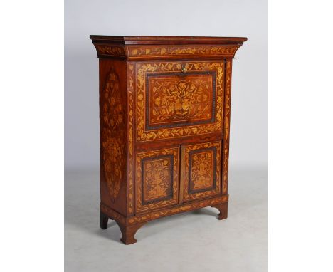 A 19th century Continental mahogany and marquetry escritoire, the rectangular top above a concave frieze drawer and hinged fa