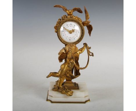 A late 19th/ early 20th century ormolu and white marble mantle clock, the white enamel dial with Arabic numerals and floral g