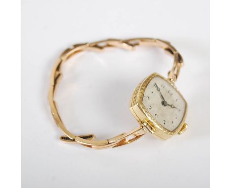 An 18ct gold ladies Rolex Prima 15 Jewel wristwatch, with engine turned Arabic numeral dial, and expandable bracelet.