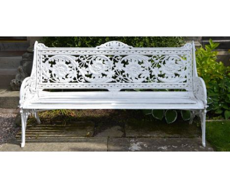 A Coalbrookdale style white painted cast metal garden bench, the foliate and scroll cast back with corresponding ends above a