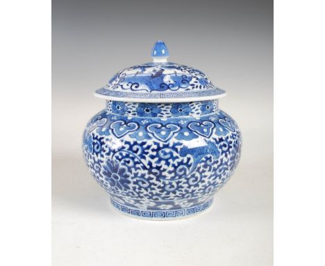 A Chinese blue and white porcelain bowl and cover, Qing Dynasty, the bowl decorated with lotus scroll within ruyi, blossom an