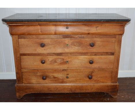 A 19th century French marble top mahogany commode, the mottled black marble top above a blind frieze drawer and three long dr