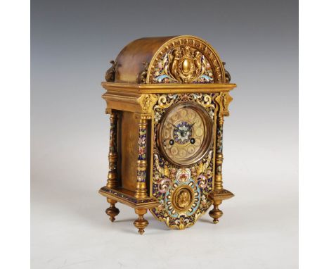 A late 19th century French champleve enamel mantle clock, the circular dial with Arabic numerals and twin train movement stam