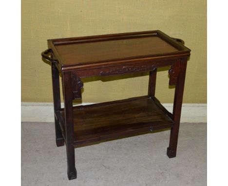 A Chinese Huanghuali serving table, late Qing Dynasty, the panelled rectangular top with a pair of pierced carrying handles a