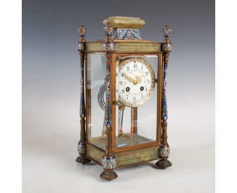 A late 19th/ early 20th century French onyx and champleve enamel mantle clock, the circular enamel dial with Arabic numerals 