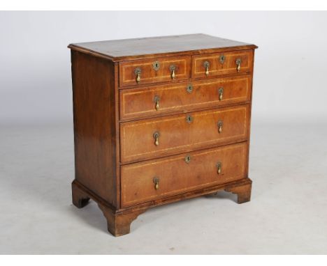 An 18th century walnut chest, the rectangular top with herringbone inlaid border and moulded edge, above two short and three 