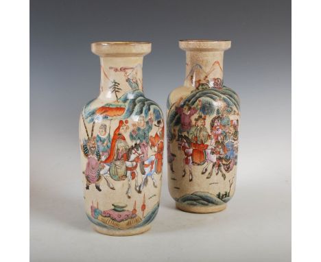 A pair of Chinese porcelain famille rose crackle glazed rouleau vases, late Qing Dynasty, decorated with Warriors and Scholar