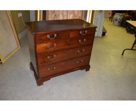 A George III mahogany chest of small size, the rectangular top with a moulded edge above two short and three long graduated c