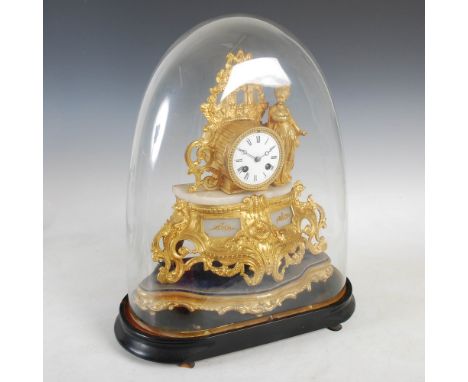 A late 19th century gilt metal and onyx mantle clock, the circular enamel dial with Roman numerals and twin train escapement 