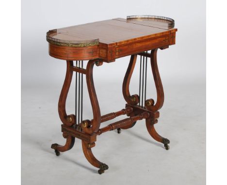 A 19th century Regency style rosewood and brass inlaid games table, with detachable rectangular slide inlaid with a chequer b