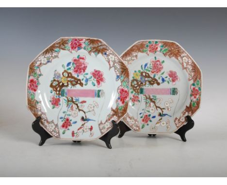A pair of Chinese porcelain famille rose octagonal shaped plates, Qing Dynasty, decorated with scroll shaped panel of bird an