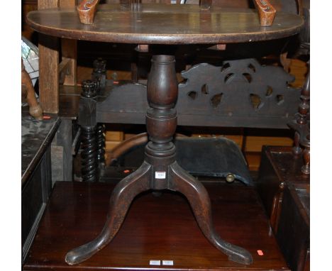 A George III oak tilt top tripod table