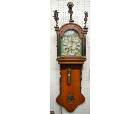 A 19th century Dutch friesian wall clock with alarm, having 30 hour weight driven movement
