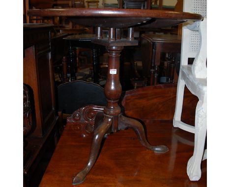 A George III mahogany birdcage tilt top tripod table