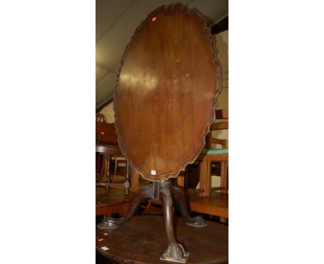 A 19th century mahogany tilt top tripod table, having a piecrust edge