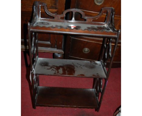 A pierced mahogany three tier hanging wall shelf, together with one other mirror back waterfall example (2)