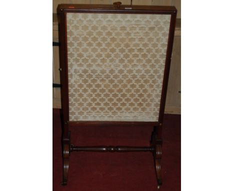 A Regency mahogany and silk inset firescreen, having rise-and-fall action 