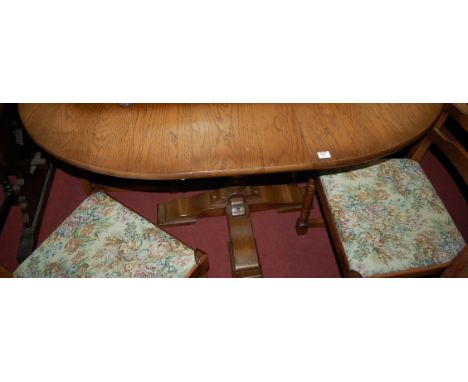 A modern moulded oak dining suite comprising; extending table with pull-out action and single extra fold-out leaf, a set of f