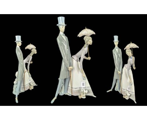 Lladro Huge and Impressive Hand Painted Porcelain Figure ' Couple with Parasol ' Model No 4563. Issued 1969 - 1985. Height 19