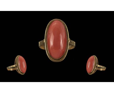Ladies 14ct Gold Single Stone Coral Set Ring, Marked 14ct to Interior of Shank. The Elongated Oval Shaped Coral Stone of Good
