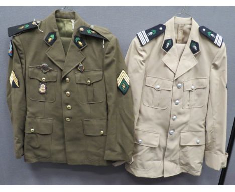Two French Foreign Legion Uniforms consisting khaki, single breasted, open collar tunic. &nbsp;Pleated chest and lower patch 
